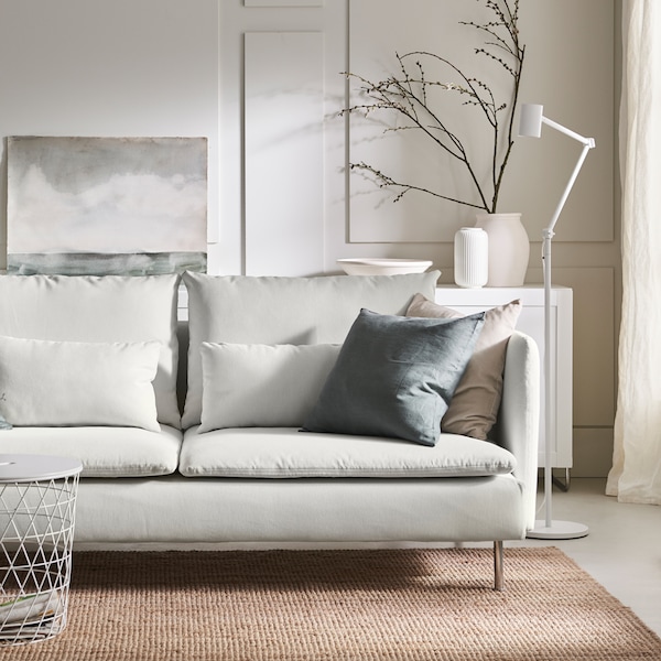 A white SÖDERHAMN 3-seat sofa in a calm, minimalistic living room.